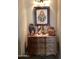 Wooden sideboard displaying Native American artwork at 9510 W Menadota Dr, Peoria, AZ 85382
