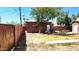 Backyard view of detached studio and grassy area at 9807 E University Dr, Mesa, AZ 85207