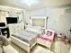 Main bedroom with a queen bed, dresser, and a toddler bed at 5418 W Belleview St, Phoenix, AZ 85043
