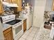 Kitchen with granite countertops, wooden cabinets and electric stove at 5418 W Belleview St, Phoenix, AZ 85043