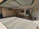 Two-car garage with built-in storage cabinets and overhead door opener at 15406 W Sky Hawk Dr, Sun City West, AZ 85375