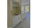 Wet bar with white cabinets, quartz countertop and wine rack at 3981 N 155Th Ave, Goodyear, AZ 85395