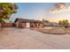 Side view of single story home with carport and yard at 4301 E Bluefield Ave, Phoenix, AZ 85032