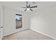 Bright bedroom with neutral walls, ceiling fan, and carpet flooring at 4301 E Bluefield Ave, Phoenix, AZ 85032