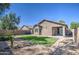 House backyard with grassy area and block wall at 913 S 115Th Dr, Avondale, AZ 85323