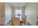 Dining area with a wood table and chandelier near the kitchen at 913 S 115Th Dr, Avondale, AZ 85323