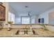 Kitchen sink with granite countertop and view into living room at 913 S 115Th Dr, Avondale, AZ 85323