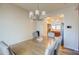 Dining room with a view of the kitchen and a chandelier at 913 S 115Th Dr, Avondale, AZ 85323