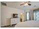 Spacious bedroom with ensuite bathroom and large window at 913 S 115Th Dr, Avondale, AZ 85323