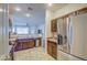 Modern kitchen with stainless steel appliances and dark wood cabinets at 913 S 115Th Dr, Avondale, AZ 85323