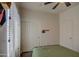 Bedroom with a metal bed frame and double door closet at 913 S 115Th Dr, Avondale, AZ 85323