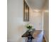 Bright entryway with a console table, flowers, and artwork at 913 S 115Th Dr, Avondale, AZ 85323