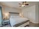 King-size bed in a well-lit bedroom with double closets at 913 S 115Th Dr, Avondale, AZ 85323
