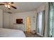Bright bedroom with ensuite bathroom and large window at 913 S 115Th Dr, Avondale, AZ 85323