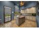 Bright laundry room with island and French doors at 9705 E Cholla St, Scottsdale, AZ 85260