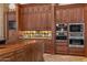 Kitchen features abundant cabinetry and high-end appliances at 9705 E Cholla St, Scottsdale, AZ 85260