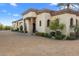 Elegant home exterior with a grand entrance and manicured landscaping at 9705 E Cholla St, Scottsdale, AZ 85260