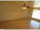 Bright living room with tile flooring and ceiling fan at 11002 W Oakmont Dr, Sun City, AZ 85351