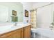 Clean bathroom with a bathtub and shower at 26723 N 127Th Dr, Peoria, AZ 85383