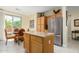 Kitchen with island, stainless steel appliances, and wood cabinets at 26723 N 127Th Dr, Peoria, AZ 85383