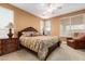 Spacious bedroom with large windows and comfortable seating at 26723 N 127Th Dr, Peoria, AZ 85383