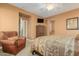 Bright bedroom featuring a comfortable bed and ample closet space at 26723 N 127Th Dr, Peoria, AZ 85383