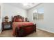 Well-lit bedroom with a queen bed and nightstands at 26723 N 127Th Dr, Peoria, AZ 85383