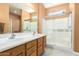 Modern bathroom with double sinks and a spacious shower at 26723 N 127Th Dr, Peoria, AZ 85383