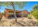 Spacious backyard with covered patio and desert landscaping at 26723 N 127Th Dr, Peoria, AZ 85383