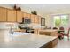 Kitchen with light wood cabinets, stainless steel appliances, and an island at 26723 N 127Th Dr, Peoria, AZ 85383