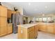 Spacious kitchen with an island and stainless steel appliances at 26723 N 127Th Dr, Peoria, AZ 85383