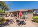 Private backyard with patio, seating area and landscaping at 22165 W Shadow Dr, Buckeye, AZ 85326