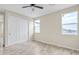 Bright bedroom with double door closet and wood-look floors at 13036 N 20Th St, Phoenix, AZ 85022