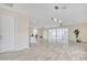 Spacious living room with wood-look floors and sliding glass doors at 13036 N 20Th St, Phoenix, AZ 85022