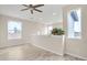 Spacious bedroom with hardwood floors and two large windows at 13036 N 20Th St, Phoenix, AZ 85022