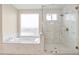 Spa-like bathroom featuring a large shower and soaking tub at 13036 N 20Th St, Phoenix, AZ 85022