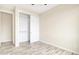 Bedroom with spacious closet and wood-look floors at 13036 N 20Th St, Phoenix, AZ 85022