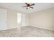 Spacious bedroom with access to bathroom and additional rooms at 13036 N 20Th St, Phoenix, AZ 85022
