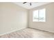 Bright bedroom with ceiling fan and wood-look floors at 13036 N 20Th St, Phoenix, AZ 85022