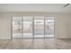 View of backyard through sliding glass doors from kitchen at 13036 N 20Th St, Phoenix, AZ 85022