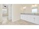 Bathroom with double vanity, granite countertops, and view of bedroom at 13036 N 20Th St, Phoenix, AZ 85022