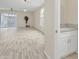 Bright living room with hardwood floors and access to powder room at 13036 N 20Th St, Phoenix, AZ 85022