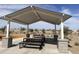 Covered picnic area with tables and benches, ideal for outdoor gatherings at 5663 S 240Th Ln, Buckeye, AZ 85326