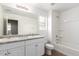 Bathroom with double vanity, bathtub and toilet at 824 E Agua Fria Ln, Avondale, AZ 85323