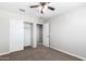 Bedroom with double door closet and ceiling fan at 824 E Agua Fria Ln, Avondale, AZ 85323
