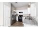 Modern kitchen with white cabinets and stainless steel appliances at 824 E Agua Fria Ln, Avondale, AZ 85323