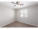 Bedroom with ceiling fan and window coverings at 824 E Agua Fria Ln, Avondale, AZ 85323