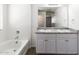Bathroom with double vanity, bathtub, and separate shower at 824 E Agua Fria Ln, Avondale, AZ 85323