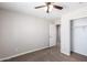 Bedroom with ceiling fan and closet at 824 E Agua Fria Ln, Avondale, AZ 85323