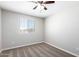 Bright bedroom with ceiling fan and carpeting at 824 E Agua Fria Ln, Avondale, AZ 85323